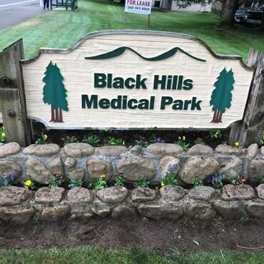 Plants in fron of Black Hills Medical park sign.